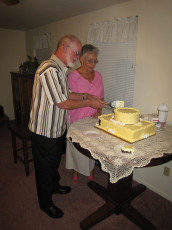 Cake-cutting at their 50th wedding anniversary
