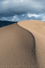 is a photograph by T.M. Schultze taken at Great Sand Dunes National Park, Colorado