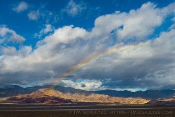 Badwater Rainbow is a photograph by T.M. Schultze taken at Death Valley National Park, California