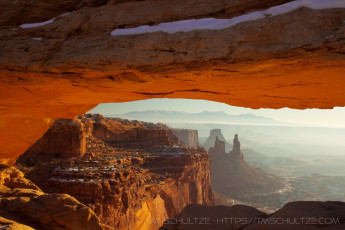Mesa and Washer Woman Arches is a photograph by T.M. Schultze taken 2010 at Canyonlands National Park, Utah