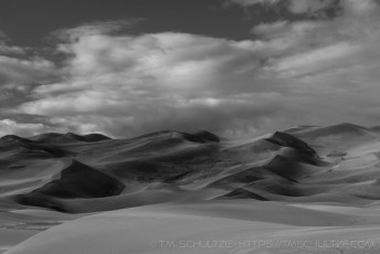 is a photograph by T.M. Schultze taken at Great Sand Dunes National Park, Colorado