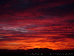 Red Dawn is a photograph by T.M. Schultze taken  at Joshua Tree National Park, California