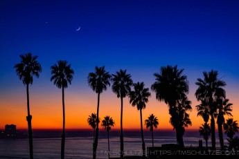 Sunset, Moon, Venus, at La Jolla Shores is a photograph by T.M. Schultze taken 2011 at San Diego, California