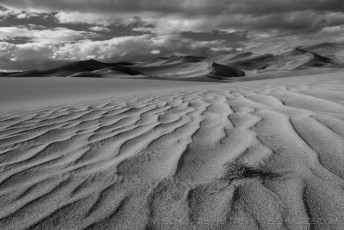 Storm Over Sand Dunes is a photograph by T.M. Schultze taken 2014 at Great Sand Dunes National Park, Colorado