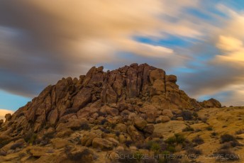 Cloudscape Mastodon Mountain Joshua Tree is a photograph by T.M. Schultze taken at Joshua Tree National Park, California