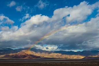 Badwater Rainbow is a photograph by T.M. Schultze taken at Death Valley National Park, California