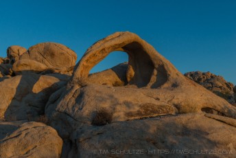 Last Light On The Arch JT is a photograph by T.M. Schultze taken at Joshua Tree National Park, California