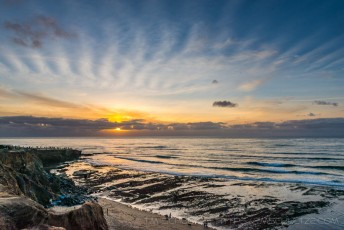 Cloud Rays is a photograph by T.M. Schultze taken at Sunset Cliffs Natural Park, California