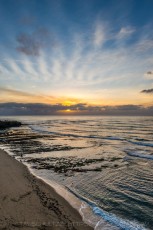 Cloud Rays Vertical is a photograph by T.M. Schultze taken at Sunset Cliffs Natural Park, California