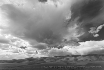is a photograph by T.M. Schultze taken at Great Sand Dunes National Park, Colorado