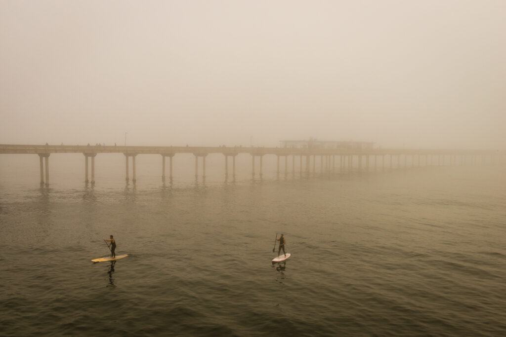 Paddling By The Pier